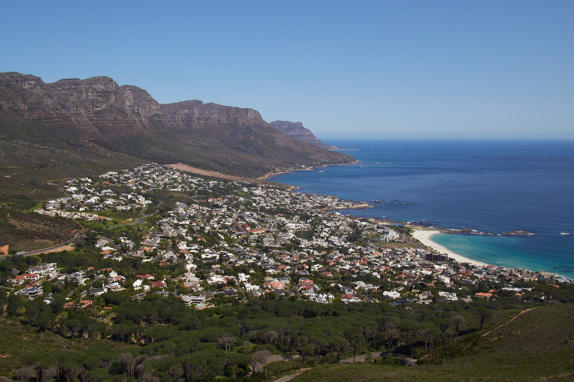 Aerial view of Camps Bay below the Twelve Apostles on Cape Town's Atlantic seaboard