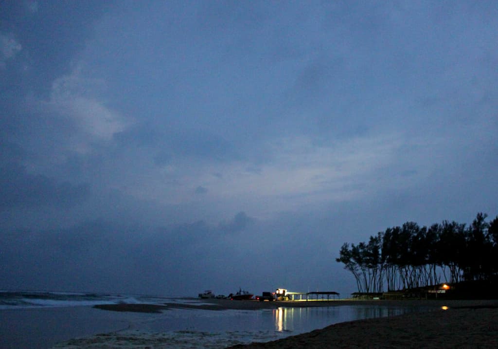 Fishing boats launching from Sodwana Bay beach at first light of dawn, KwaZulu-Natal, South Africa