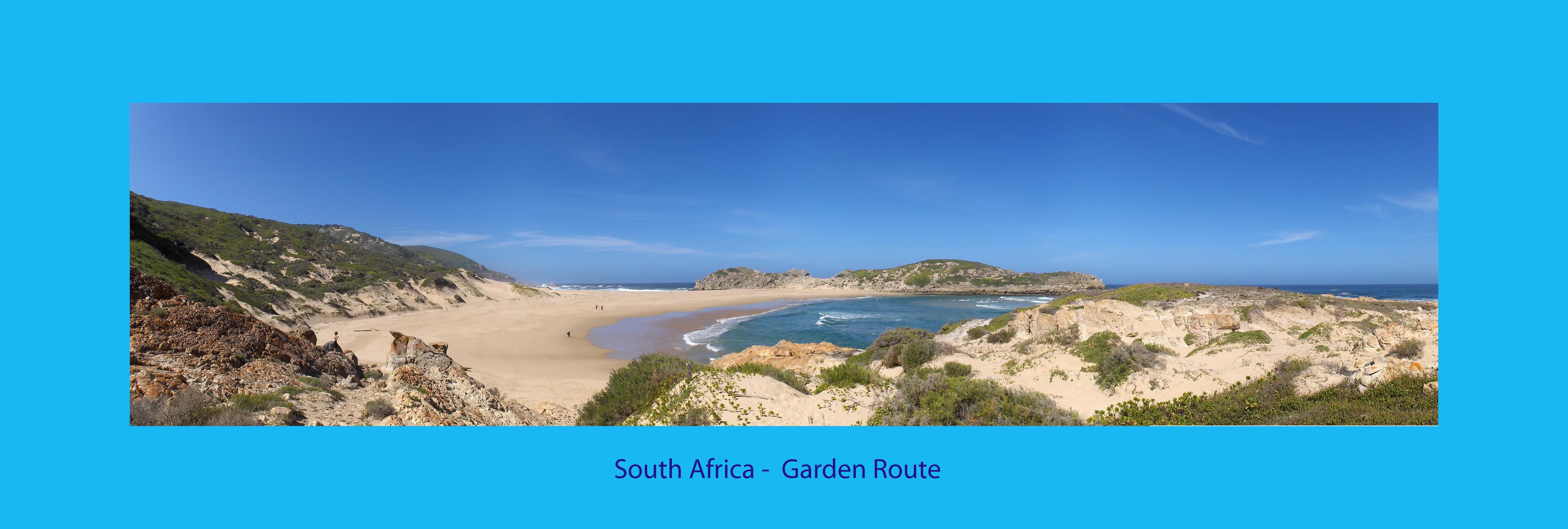 Wide panoramic view of the Plettenberg Bay coastline and beach along the Garden Route, Western Cape, South Africa